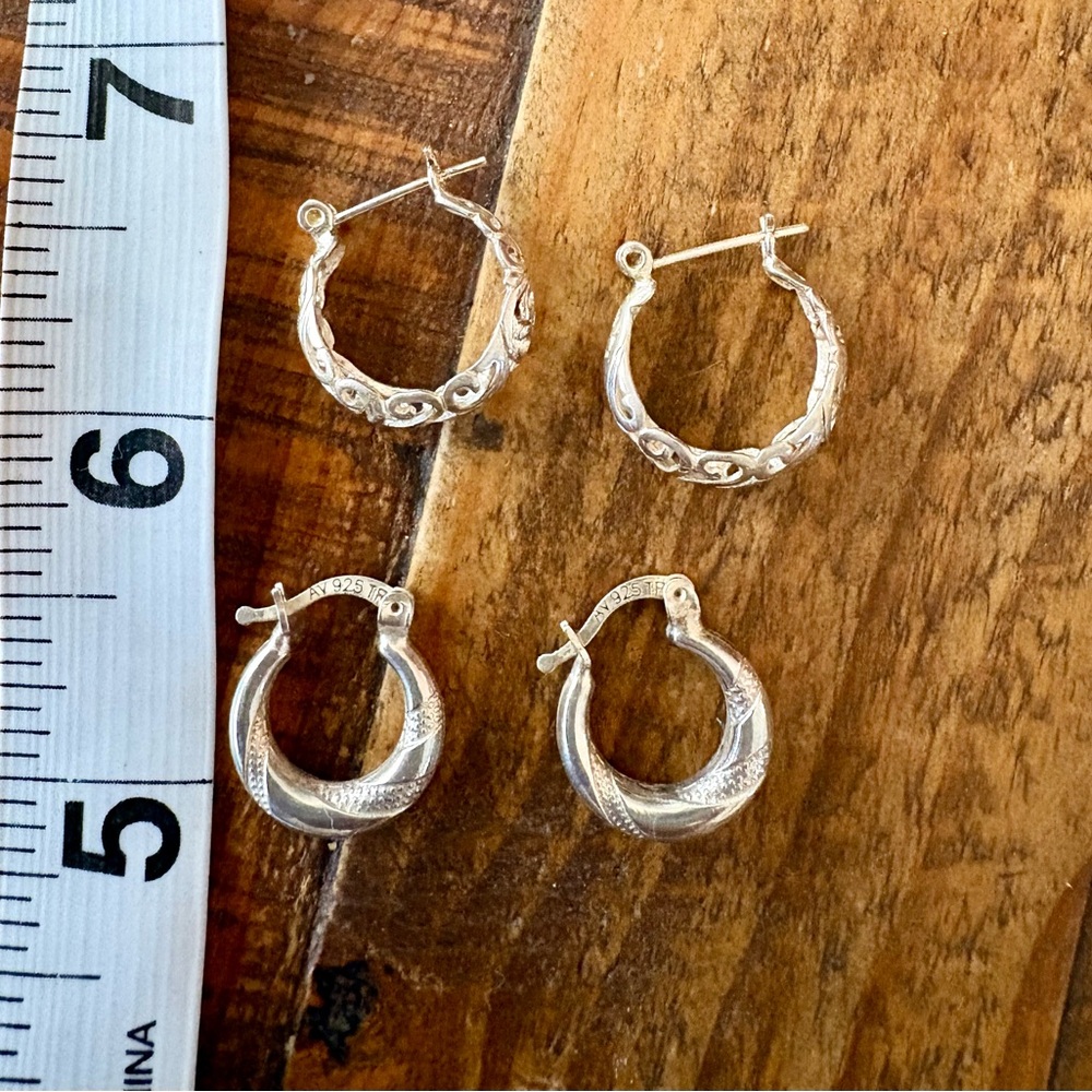 Two pair of small sterling silver hoops, one etched, one filigree